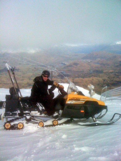 Chris Walker from the Coronet Peak maintenance department reveling in the snow.